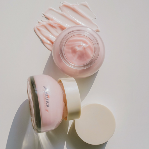 Creamy, light pink, reviving rose infusion cream in glass jars