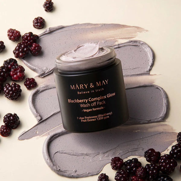 Open jar of Mary & May Blackberry Complex Glow Wash Off Pack surrounded by fresh blackberries and a rich textured swipe of the product.