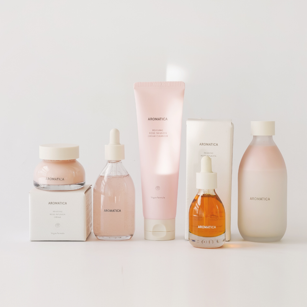 Aromtica reviving rose infusion full set including toner, cleanser, cream, face oil, and serum.