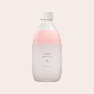 Light pink natural Aromatica Reviving Rose Toner in a glass bottle