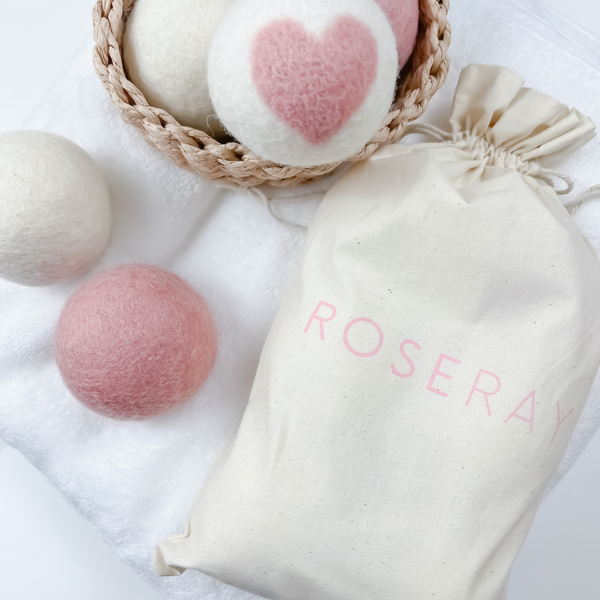 Baby pink heart on white 100% wool dryer ball with white wool dryer ball and roseray cotton bag