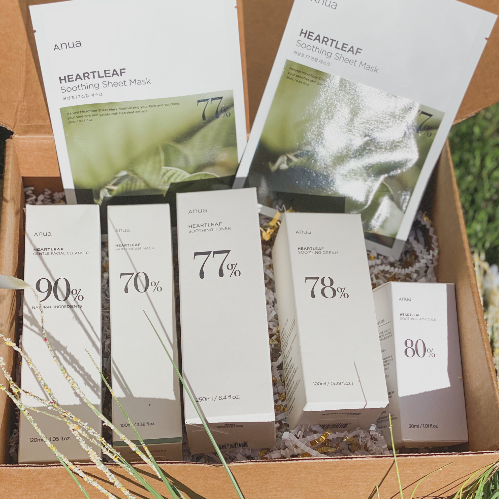 ANUA heartleaf skincare set including cleanser, cream mask, toner, ampoule, cream, and two sheet masks