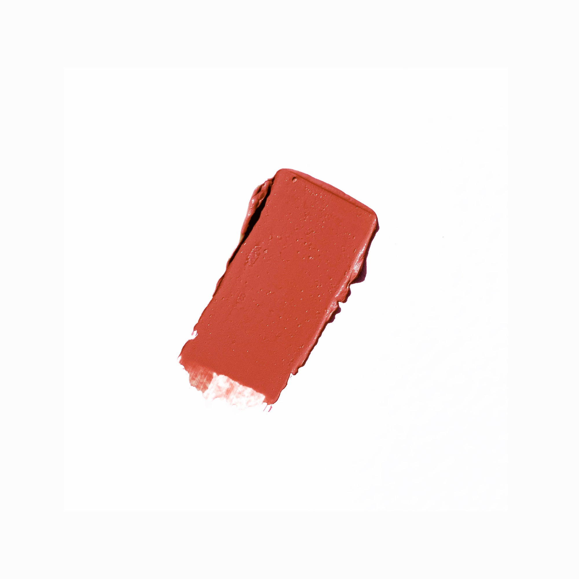 Yulip lipstick in am11, a burnt coral and orange shade in black tube packaging